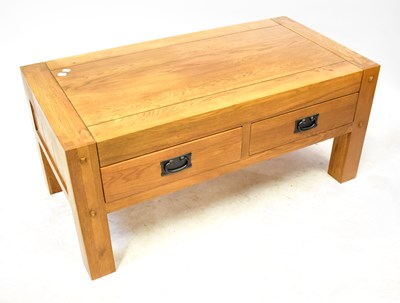 Lot 30 - An oak coffee table with a pair of drawers to...