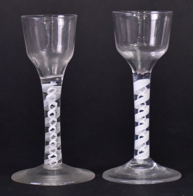 Lot 564 - Two Georgian air twist stem wine glasses,...