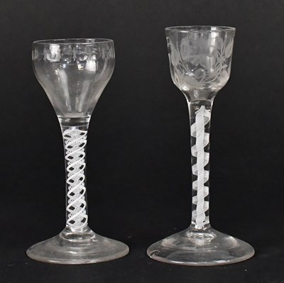 Lot 565 - Two Georgian air twist stem wine glasses, one...