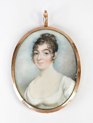 Lot 331 - An 1820s portrait miniature of a young lady,...