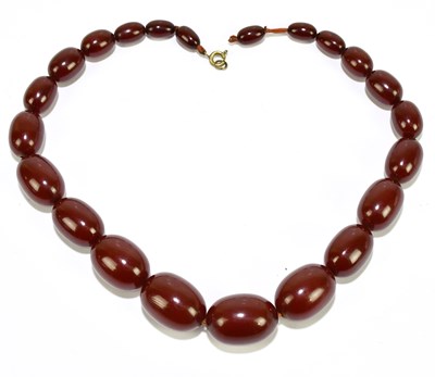 Lot 1365 - A strand of cherry amber beads, length 46cm,...