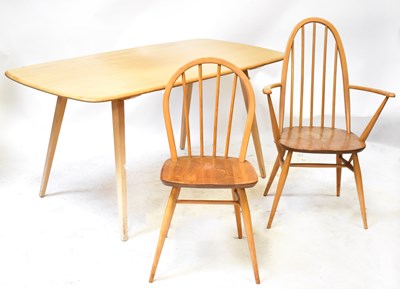 Lot 2 - ERCOL; a light elm dining table on square...