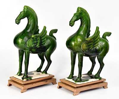 Lot 175 - A pair of mid-20th century green glazed Tang...
