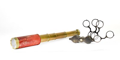 Lot 658 - A pair of folding multiple lensed glasses and...
