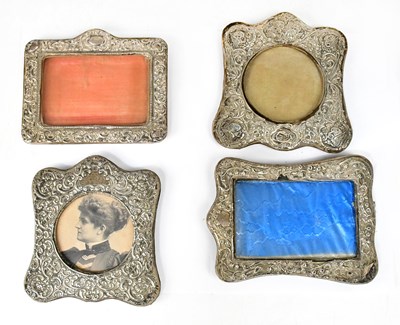 Lot 918 - Four various tabletop silver clad photograph...