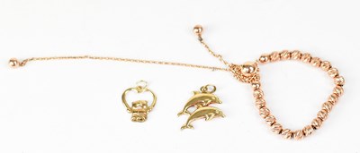 Lot 1044 - A 9ct rose gold fine chain bracelet, set with...
