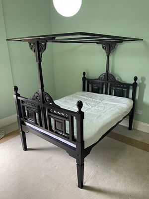 Lot 1284 - A good ebonised Indian bed, the canopy...