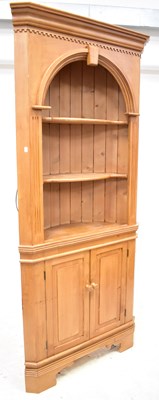 Lot 101 - A modern waxed pine floor standing corner...