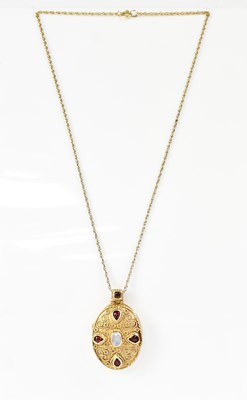 Lot 1085 - A silver and gold-plated locket in the...