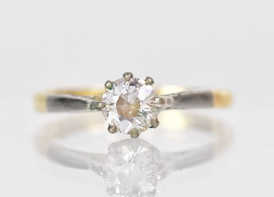Lot 1015 - An 18ct yellow gold diamond solitaire ring in...