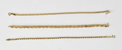 Lot 1048 - Three 9ct gold chain link bracelets, one...