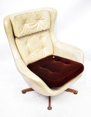 Lot 57 - A mid-20th century cream leatherette egg-style...