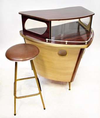 Lot 75 - A 1960s laminated cocktail bar in the form of...