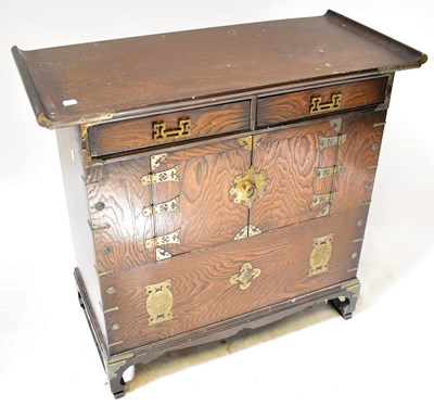 Lot 550 - A Korean elm morijang cabinet, with an...