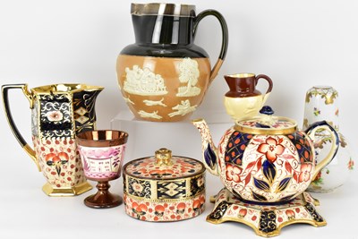 Lot 396 - ROYAL DOULTON; a large stoneware tavern jug...
