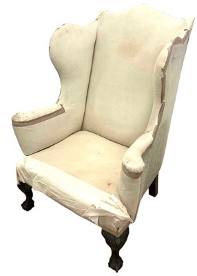 Lot 680 - A 19th century wingback armchair of generous...