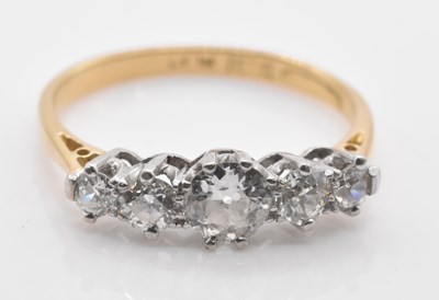Lot 459 - An 18ct yellow gold platinum tipped five stone...