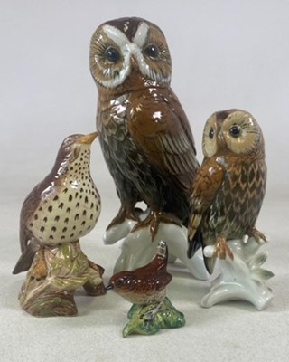 Lot 156 - KARL ENS; two barn owl figures each perched on...