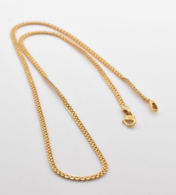 Lot 469 - A yellow metal chain, stamped '22K', length...
