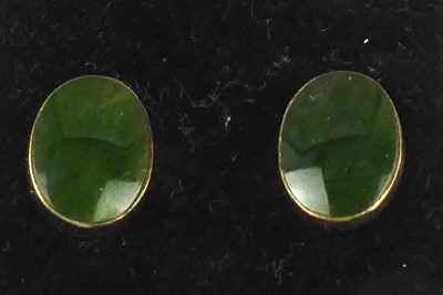 Lot 1191 - A pair of 9ct gold jade earrings, the oval...