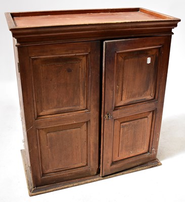 Lot 86 - A 19th century mahogany wall-hanging cupboard...