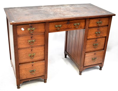 Lot 118 - An Edwardian mahogany kneehole desk of nine...