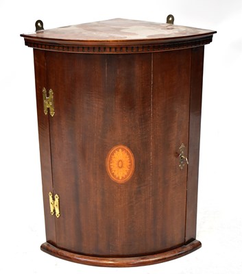 Lot 88 - An Edwardian wall-hanging mahogany bow-fronted...