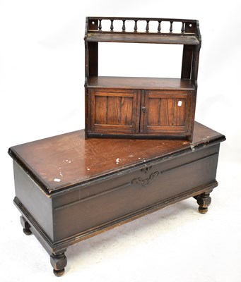 Lot 84 - An Edwardian elm wall shelf with cupboard...