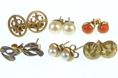 Lot 1195 - Four pairs of gold stud earrings to include...