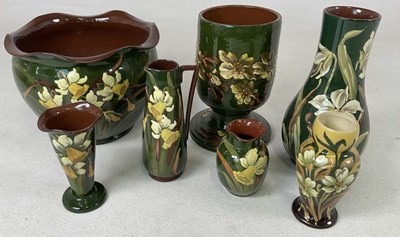 Lot 239 - DEVON POTTERY; a large pot with a daffodil...