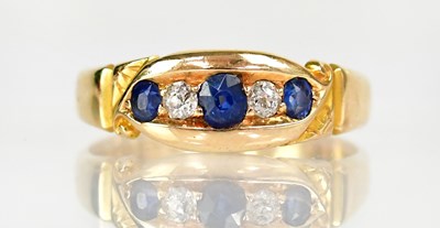 Lot 1021 - An 18ct yellow gold five stone ring, with...