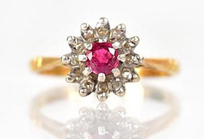 Lot 1018 - An 18ct yellow gold diamond and ruby floral...