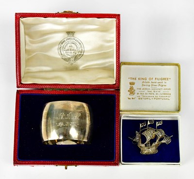 Lot 845 - A small sterling silver filigree brooch in the...