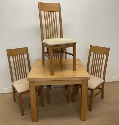 Lot 701 - G PLAN; an extending dining table and four...