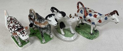 Lot 220 - Four Staffordshire cow creamers, all have no...