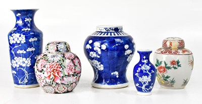 Lot 547 - Three blue and white vases decorated with...