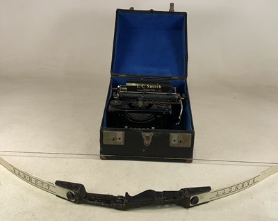Lot 49 - L C SMITH; a black typewriter, cased, together...