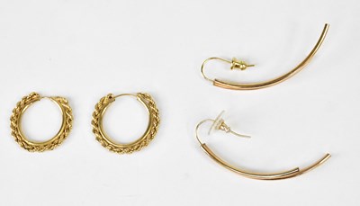 Lot 1103 - A pair of 9ct yellow gold hoop earrings with...