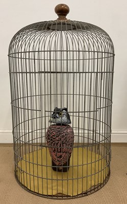 Lot 33 - A large bird cage, with a painted wooden owl...