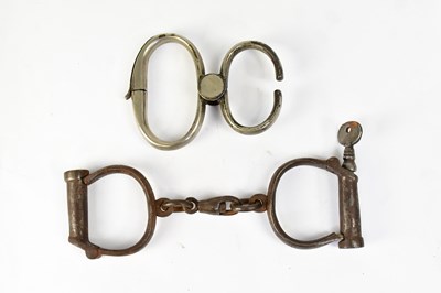 Lot 647 - Two vintage pairs of Hiatt handcuffs including...