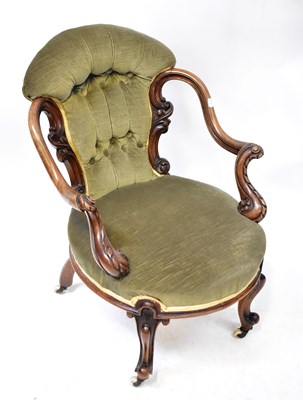 Lot 23 - A Victorian walnut open elbow nursing chair...