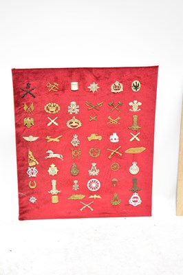 Lot 474 - Seventy-four regimental badges mounted on two...