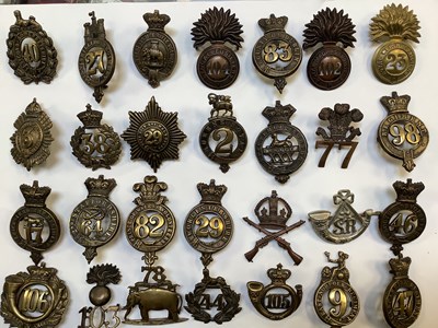 Lot 468 - A collection of regimental cap badges, to...