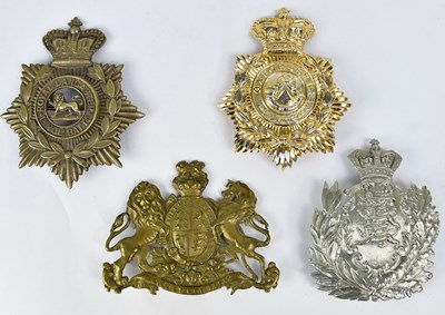 Lot 472 - Four large regimental helmet plates,...