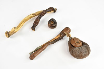 Lot 1679 - A Japanese opium pipe with carved root wood...