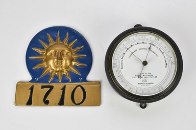 Lot 1489 - A painted cast metal fire plaque numbered 1710,...