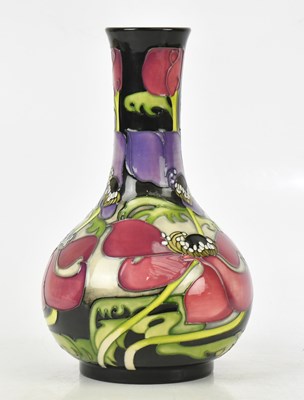 Lot 98 - EMMA BOSSONS FOR MOORCROFT; a baluster shaped...