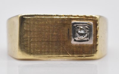 Lot 543 - A yellow metal signet ring, with tiny diamond...