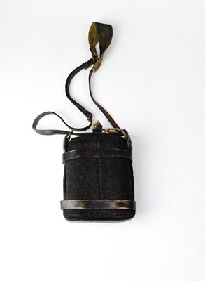 Lot 550 - A blue enamelled felt-wrapped water canteen...