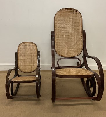 Lot 733 - A bentwood rocking chair with caned back seat,...